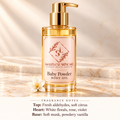 ShakeLuxe baby powder body oil with SL logo and fragrance notes: fresh aldehydes, soft citrus, white florals, rose, violet, soft musk and powdery vanilla.