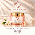 ShakeLuxe Sweet Kiss Dusting Powder with SL branding; gardenia, vanilla and amber fragrance notes